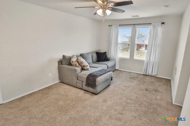 living room featuring light carpet and ceiling fan