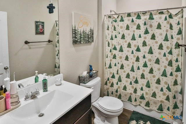 full bathroom featuring shower / bath combo, vanity, toilet, and hardwood / wood-style floors