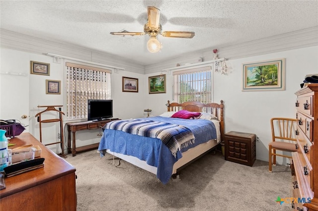 134 Daisy Ln, Whitney, TX 76692 - bedroom with light carpet, a textured ceiling, and a ceiling fan