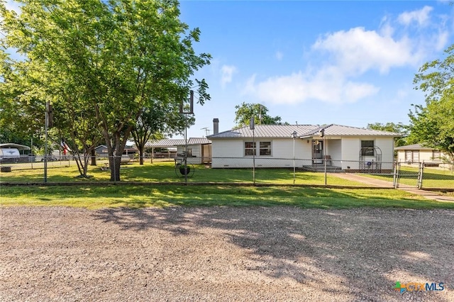 134 Daisy Ln, Whitney, TX 76692 - view of front of house with metal roof and a gate