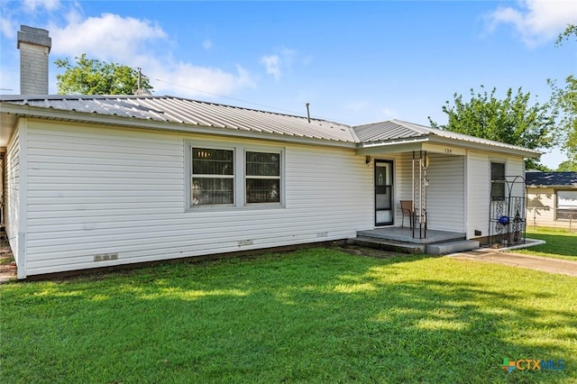 134 Daisy Ln, Whitney, TX 76692 - ranch-style home featuring a front lawn, crawl space, metal roof, a porch, and a chimney