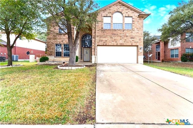 view of front of home with a front lawn and a garage