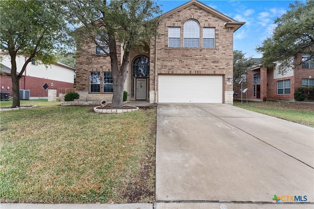 front of property with a front lawn and a garage