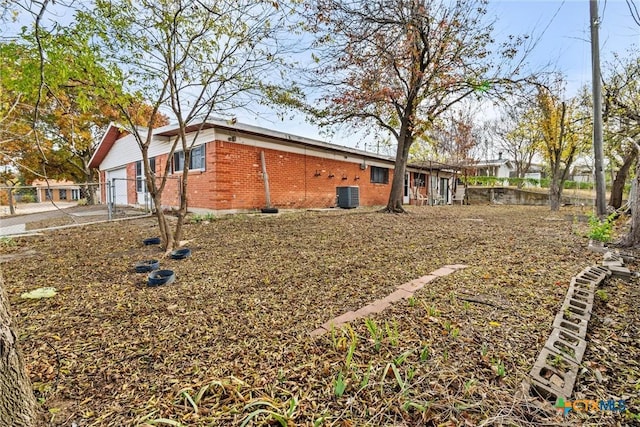 view of side of home featuring central AC unit