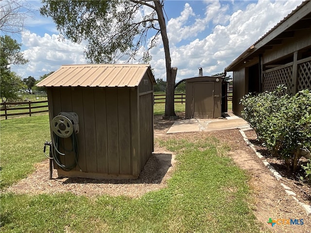 view of outbuilding featuring a yard