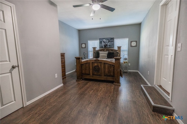 bedroom featuring dark hardwood / wood-style floors and ceiling fan