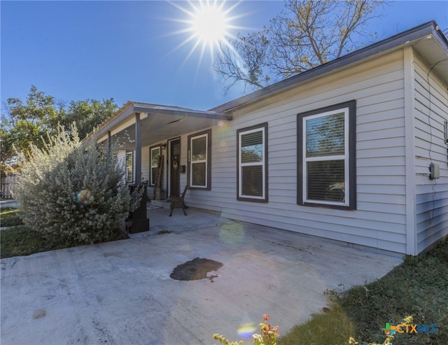 view of home's exterior featuring covered porch