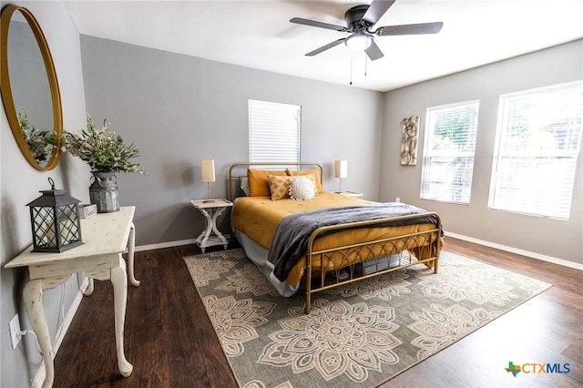 bedroom featuring ceiling fan and dark hardwood / wood-style floors