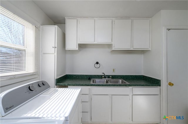 laundry area with a sink, washer / clothes dryer, and cabinet space