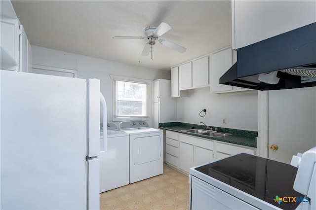 kitchen with washer and clothes dryer, a sink, white cabinetry, white appliances, and light floors