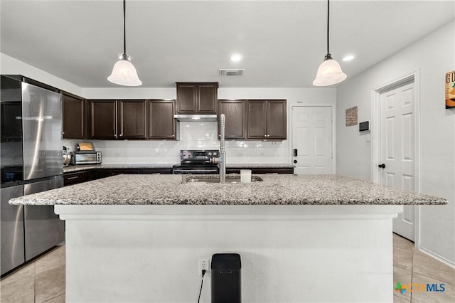 kitchen with tasteful backsplash, dark brown cabinets, visible vents, and stainless steel appliances