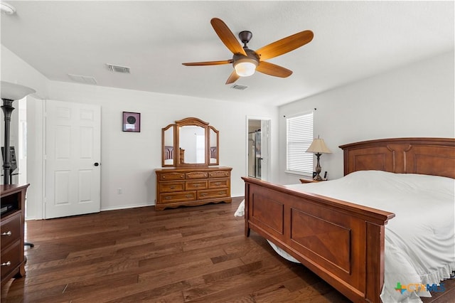 bedroom with visible vents, baseboards, dark wood-type flooring, and ceiling fan