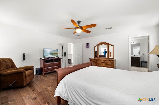 bedroom featuring hardwood / wood-style floors, visible vents, and ceiling fan