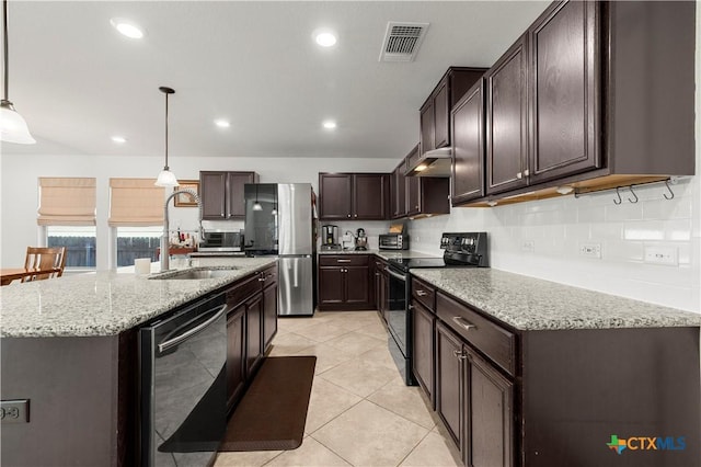 kitchen with visible vents, freestanding refrigerator, a sink, dishwasher, and black electric range oven