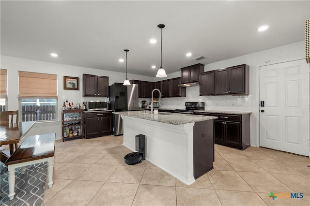 kitchen with a sink, stainless steel appliances, visible vents, and dark brown cabinets