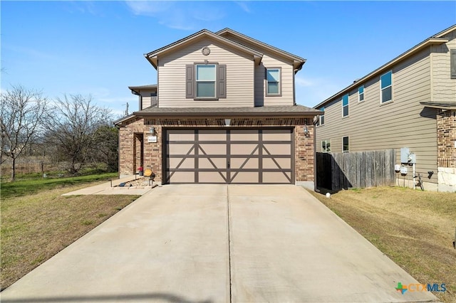 traditional-style house featuring concrete driveway, an attached garage, brick siding, and a front lawn