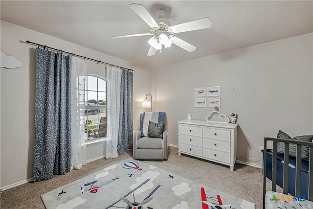 bedroom featuring baseboards, carpet flooring, and ceiling fan