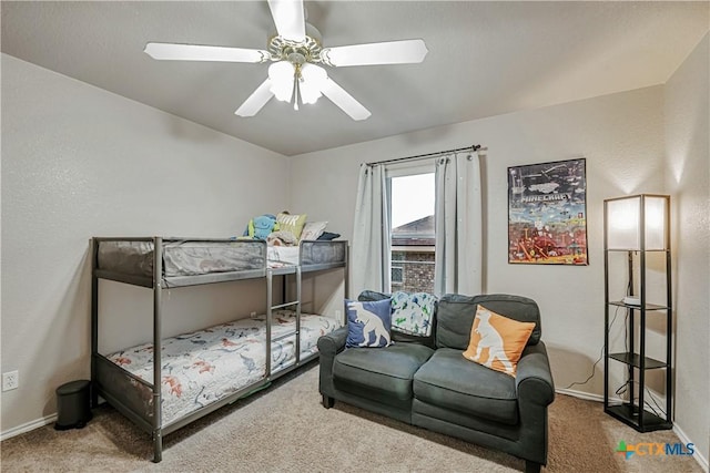 bedroom with carpet floors, a ceiling fan, and baseboards