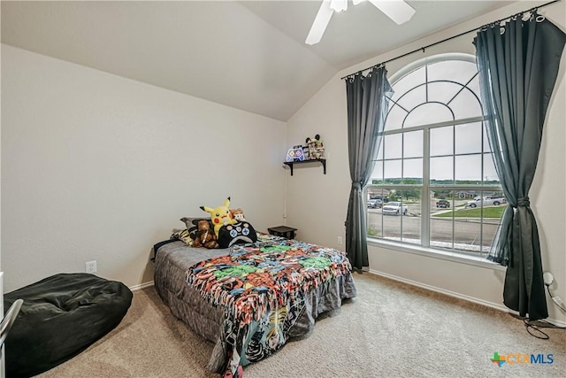 carpeted bedroom featuring a ceiling fan, baseboards, and lofted ceiling