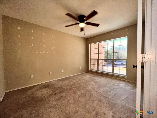 unfurnished living room with dark hardwood / wood-style flooring, vaulted ceiling, and ornate columns