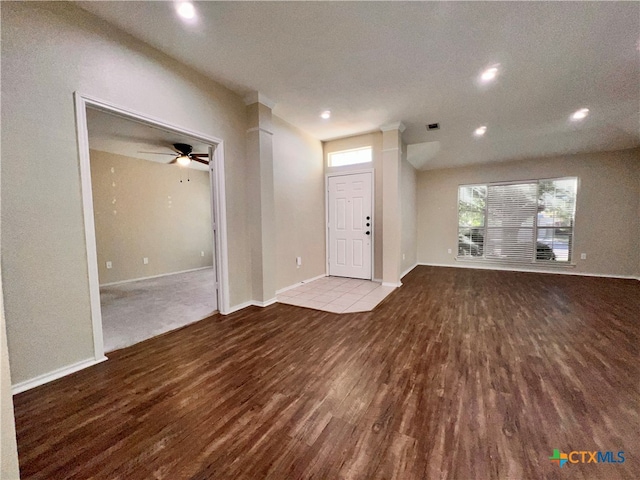 unfurnished living room featuring light wood-type flooring, a textured ceiling, and ceiling fan