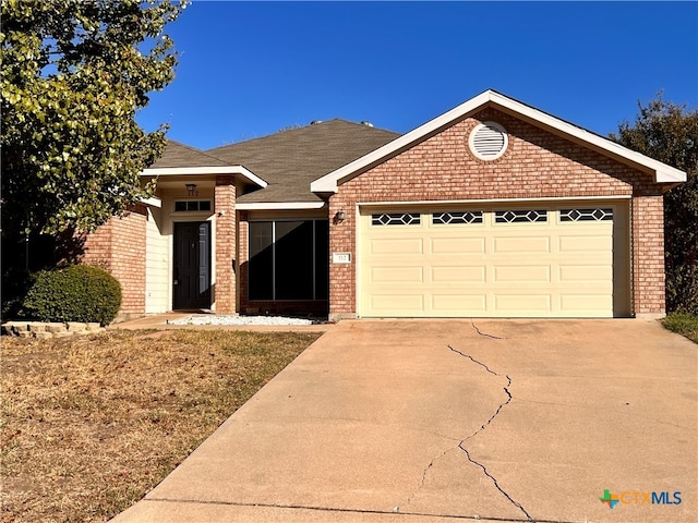 ranch-style house featuring a garage