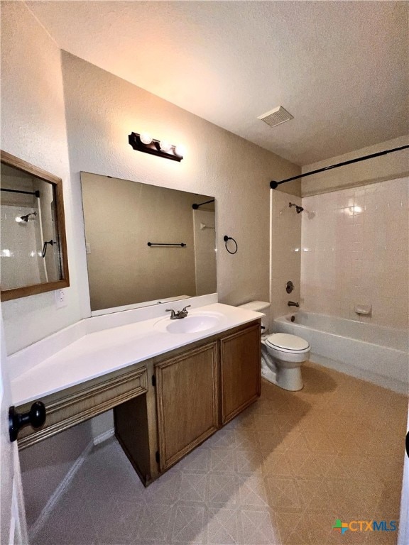 full bathroom featuring  shower combination, vanity, toilet, and a textured ceiling