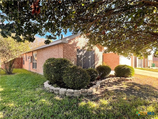 view of property exterior with a yard