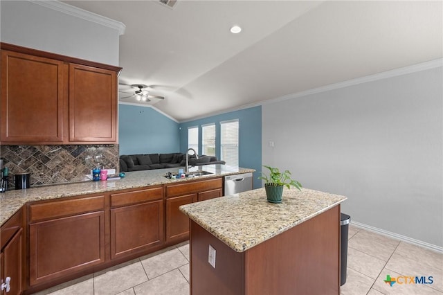 kitchen featuring a sink, dishwasher, ceiling fan, ornamental molding, and open floor plan