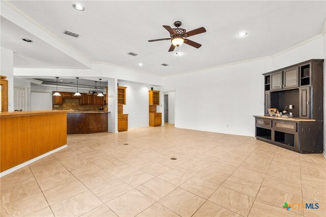 803 S Converse St, Flatonia, TX 78941 - unfurnished living room with a ceiling fan, crown molding, and recessed lighting