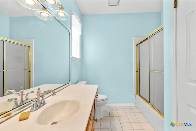 803 S Converse St, Flatonia, TX 78941 - bathroom featuring vanity, tile patterned floors, and bath / shower combo with glass door
