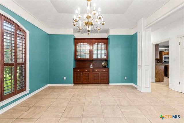 803 S Converse St, Flatonia, TX 78941 - unfurnished room featuring a chandelier and a tray ceiling