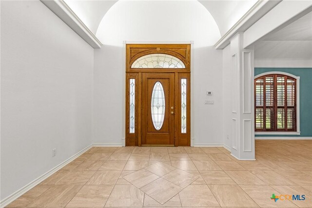 803 S Converse St, Flatonia, TX 78941 - foyer entrance featuring baseboards and high vaulted ceiling