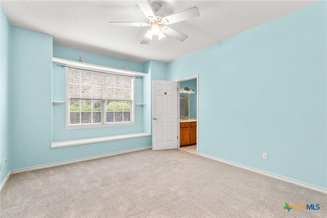 803 S Converse St, Flatonia, TX 78941 - unfurnished bedroom with light carpet and ceiling fan