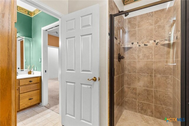 803 S Converse St, Flatonia, TX 78941 - bathroom with a shower stall, vanity, and tile patterned floors