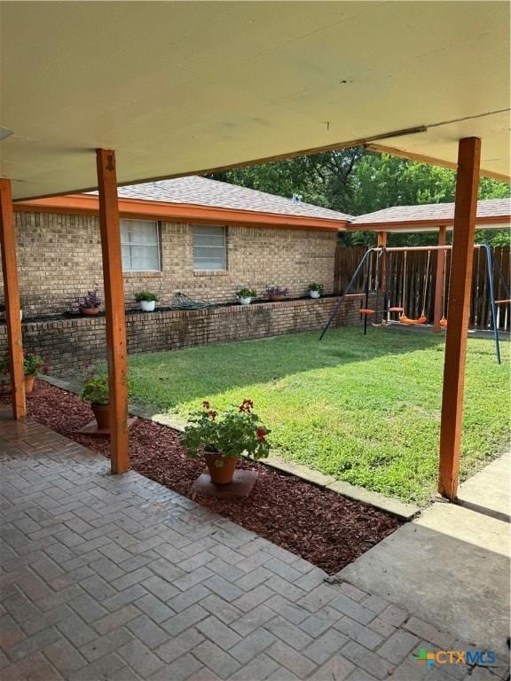 614 Cedar Dr, Copperas Cove, TX 76522 - fenced backyard featuring a patio area and a playground