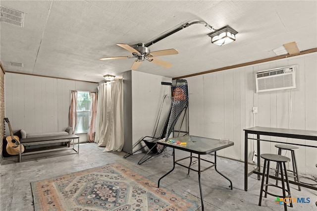 614 Cedar Dr, Copperas Cove, TX 76522 - game room with concrete floors, a wall mounted air conditioner, and a ceiling fan