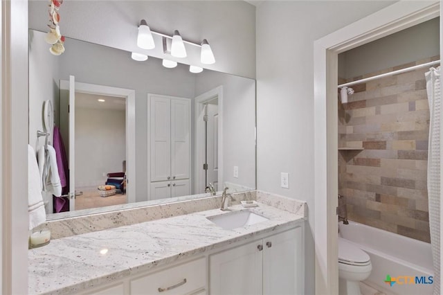 full bathroom with toilet, vanity, and shower / bathtub combination with curtain