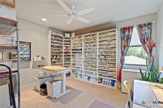 office area with light colored carpet and ceiling fan