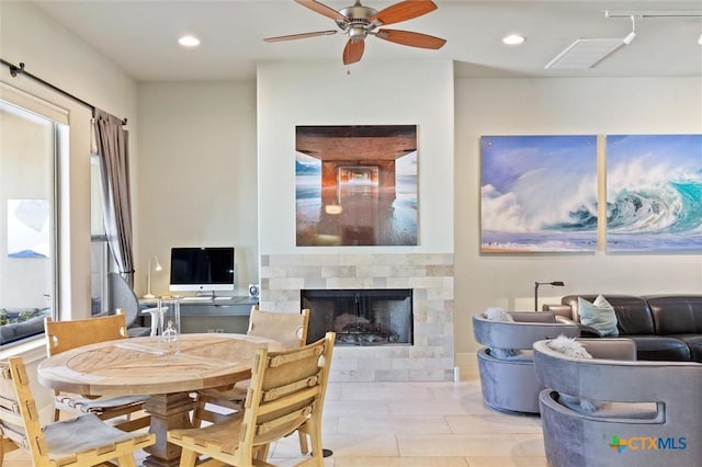 tiled dining area featuring ceiling fan