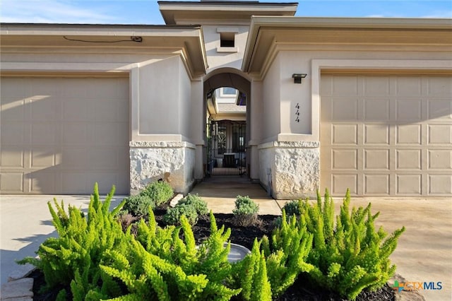 view of exterior entry with a garage