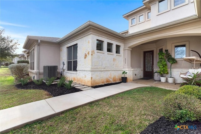 exterior space featuring a yard and central AC unit