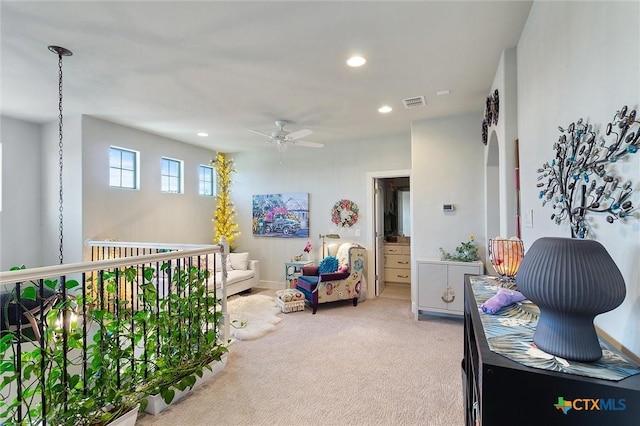 recreation room with ceiling fan and carpet flooring