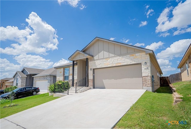 7808 Mcculloch Rd, Temple, TX 76502 - ranch-style house with board and batten siding, an attached garage, concrete driveway, and stone siding