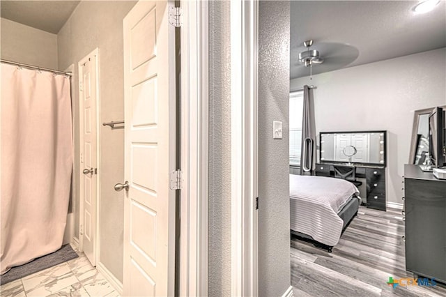 7808 Mcculloch Rd, Temple, TX 76502 - ensuite bathroom with a ceiling fan and a shower with curtain