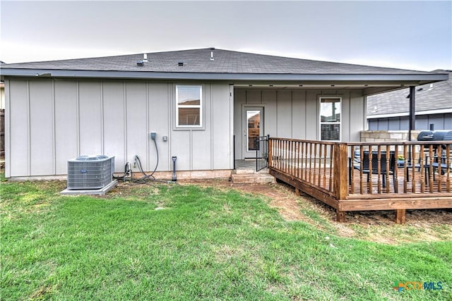 7808 Mcculloch Rd, Temple, TX 76502 - rear view of property with board and batten siding, central AC unit, a yard, and a shingled roof