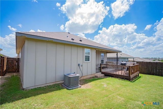7808 Mcculloch Rd, Temple, TX 76502 - rear view of property with board and batten siding, a wooden deck, and a fenced backyard