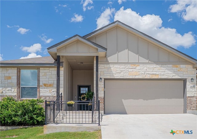 7808 Mcculloch Rd, Temple, TX 76502 - contemporary house featuring board and batten siding, concrete driveway, an attached garage, and stone siding