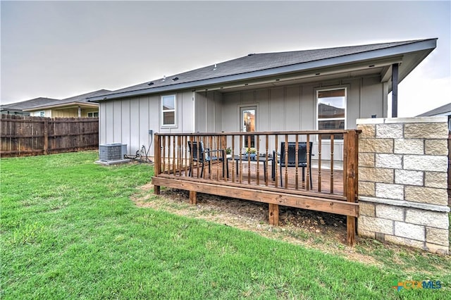 7808 Mcculloch Rd, Temple, TX 76502 - rear view of house featuring a deck, board and batten siding, roof with shingles, and central AC