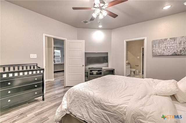 7808 Mcculloch Rd, Temple, TX 76502 - bedroom featuring wood finished floors, connected bathroom, a ceiling fan, and recessed lighting